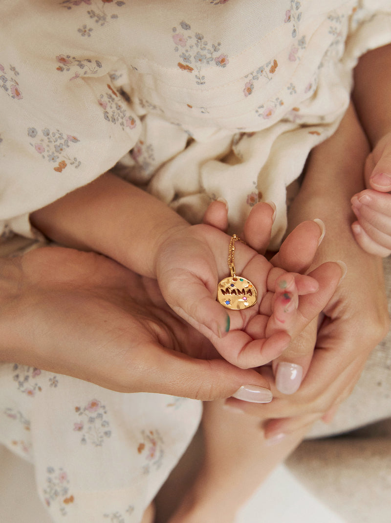 Mamá Charm, vergoldet